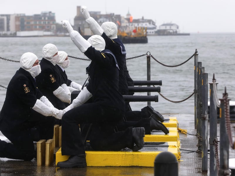 Sailors readying themselves to fire.