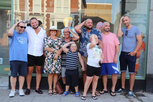 Four men shaved their head for mother-in-law Sue Partridge, to support her through breast cancer treatment. Four more family members joined and they will also hold a raffle to raise as much as possible. Pictured: Sue Partridge with her family after they braved the shave
