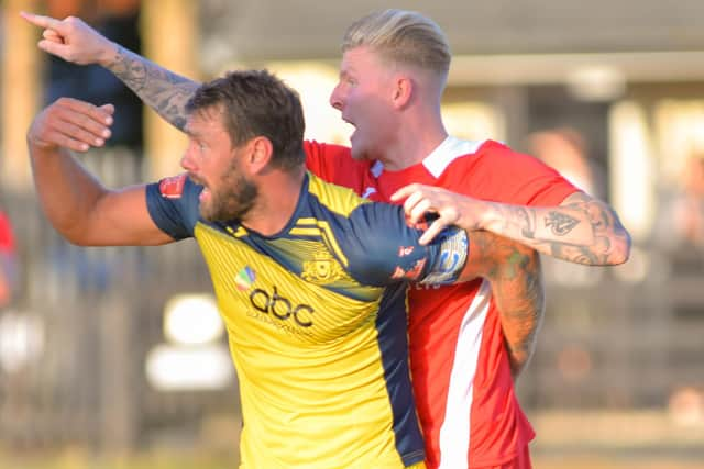 Moneyfields skipper Steve Hutchings with Horndean defender Eddie Wakley. Picture by Martyn White