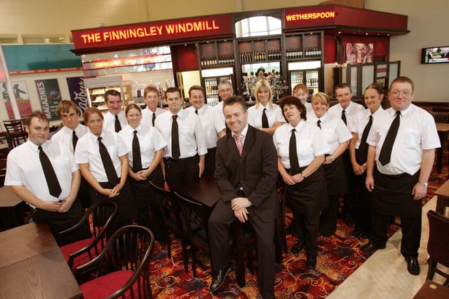Pub manager Terry Hubbard in the latest Wetherspoon pub in Doncasters Robin Hood Airport with some of his staff  in 2005
