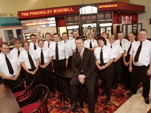 Pub manager Terry Hubbard in the latest Wetherspoon pub in Doncasters Robin Hood Airport with some of his staff in 2005