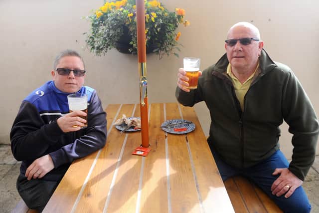 Julieanne Edwards, 40, and her dad Stephen Edwards, 59, both from Leigh Park, enjoy a catch up over a pint at The Parchment Makers Havant
Picture: Sarah Standing (120421-6489)