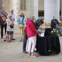 Queues form to sign the book of condolence in Portsmouth Cathedral on Friday