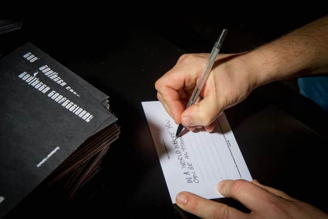 Someone anonymously writing a confession at Staggeringly Good Brewery. Picture: Habibur Rahman