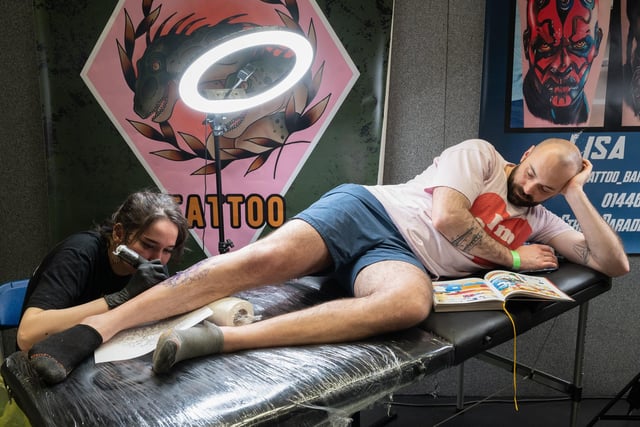 Pictured is: Kit Wagstaff works on the leg of Yohan
Picture: Keith Woodland (010421-59)