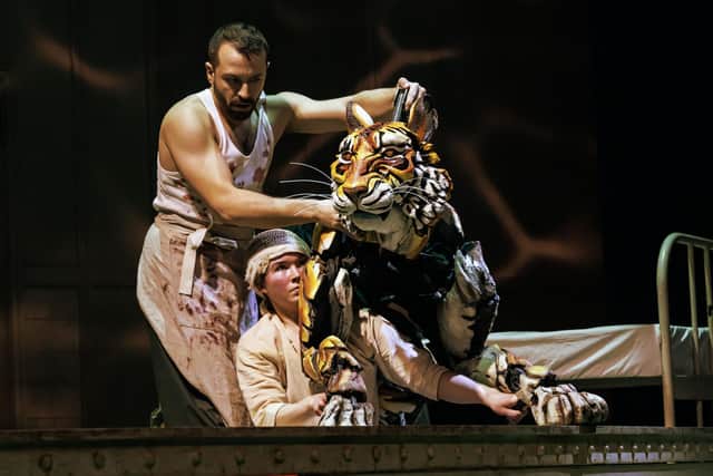Richard Parker the tiger and puppeteers in Life of Pi. Photo by Johan Persson