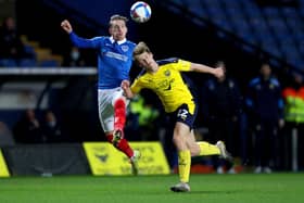 Ronan Curtis challenges Robert Atkinson after being handed striking duties in last night's 1-0 win at Oxford United. Picture: David Davies/PA Wire.