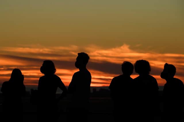 People gather to watch a conjunction. Picture: PATRICK T. FALLON/AFP via Getty Images