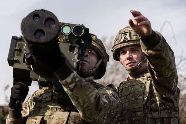 A soldier from 12 Air Assault Battery, 12 Regiment Royal Artillery, points out an enemy target ready for the High Velocity Missile (HVM) Shoulder Launcher (SL) to fire. This missile has a maximum range of up to 5.5km and is for defence against approaching low level attack aircraft and helicopters.
