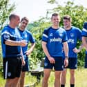 Paul Cook with members of his Pompey first-team squad in June 2015. Michael Poke, Tom Craddock, James Dunne and Paul Jones. Picture: Colin Farmery