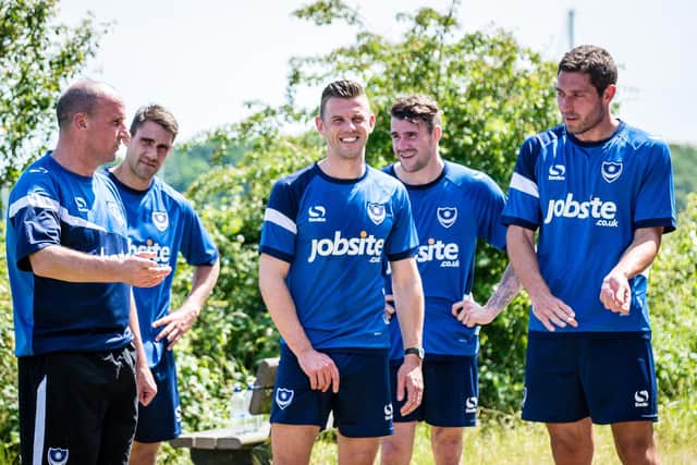 Paul Cook with members of his Pompey first-team squad in June 2015. Michael Poke, Tom Craddock, James Dunne and Paul Jones. Picture: Colin Farmery