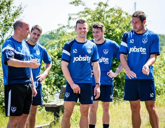 Paul Cook with members of his Pompey first-team squad in June 2015. Michael Poke, Tom Craddock, James Dunne and Paul Jones. Picture: Colin Farmery