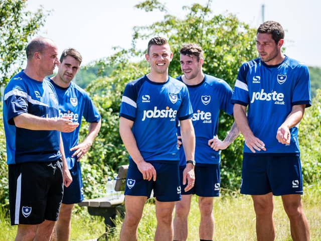 Paul Cook with members of his Pompey first-team squad in June 2015. Michael Poke, Tom Craddock, James Dunne and Paul Jones. Picture: Colin Farmery