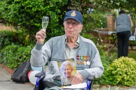 Pictured: Former RAF bomber pilot, Ian Hawkins, with a card from HRM at Langdale Care Home, Gosport.

Picture: Habibur Rahman