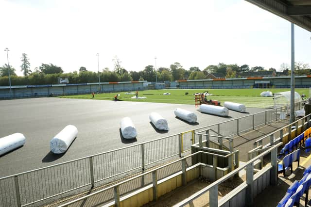 As Hawks wait for news of any government financial help, the club's new 3G pitch is being laid ahead of this weekend's FA Cup tie with Horsham at Westleigh Park. Picture: Sarah Standing