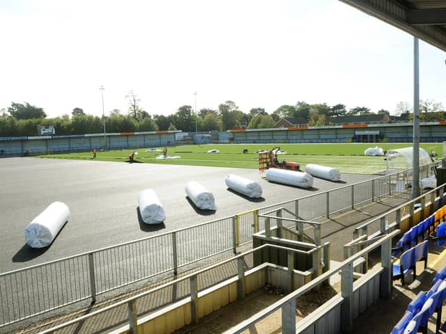 As Hawks wait for news of any government financial help, the club's new 3G pitch is being laid ahead of this weekend's FA Cup tie with Horsham at Westleigh Park. Picture: Sarah Standing