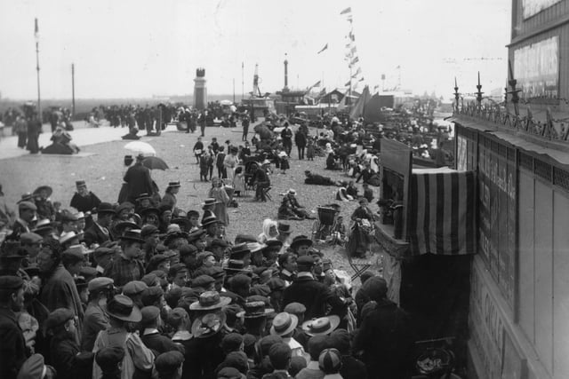 circa 1895:  Crowds watching a Punch and Judy show at Southsea.  (Photo by F J Mortimer/Hulton Archive/Getty Images)
