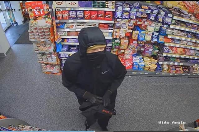 CCTV stills of a robbery at One Stop store on Copnor Road, Portsmouth 
 Picture: Hampshire Police