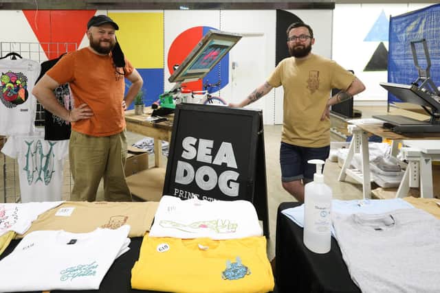 Stu Linfield, left, and Josh Willis of Sea Dog Print Studio at September's We Create market.
Picture: Chris Moorhouse   (120920-02)