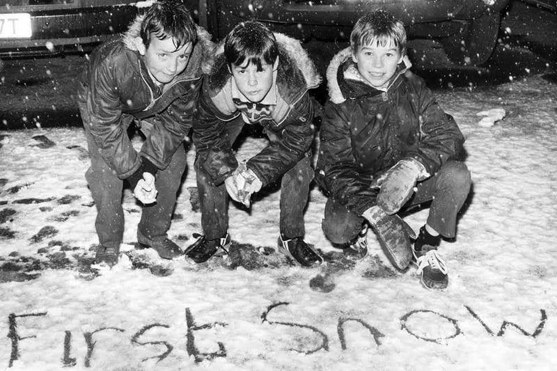 Overjoyed with the white carpet of snow which fell on Portsmouth in February 1983, these three lads signify the first snow of the winter to passers-by. L to r: Jamie Bowbrick (nine), Sean Wardel (10) and Robert Critchett (11) all of Hilsea Crescent, Hilsea, Portsmouth.