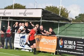 Dan Bennett celebrates his Fareham Town leveller against Poppies with fans. Picture: Paul Proctor