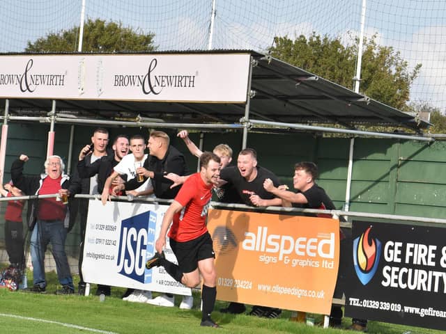 Dan Bennett celebrates his Fareham Town leveller against Poppies with fans. Picture: Paul Proctor