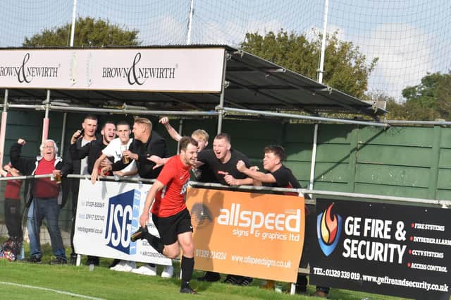 Dan Bennett celebrates his Fareham Town leveller against Poppies with fans. Picture: Paul Proctor
