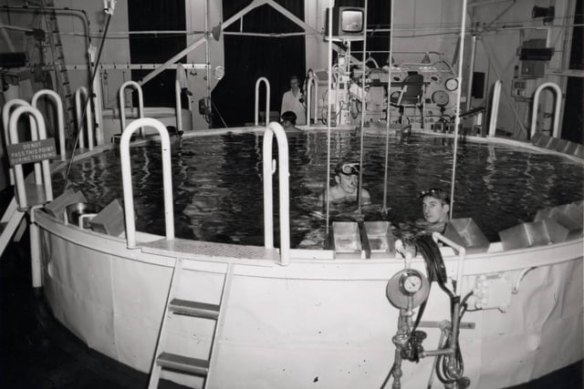 Servicemen in a submarine escape training tank at HMS Dolphin, Fort Blockhouse, Haslar Road, Gosport. This is where all submariners had to learn to escape through 100 feet of water.Credit - National Museum of the Royal Navy