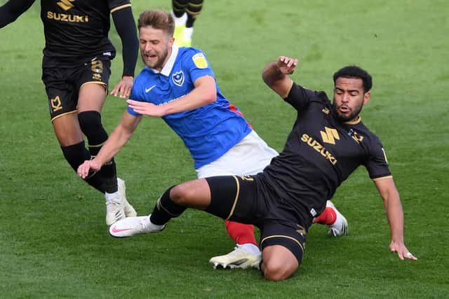 Louis Thompson in action for MK Dons against Pompey last season.  Picture: Mike Hewitt/Getty Images