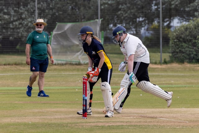 Caitlin Felstead avoids being run out. Florence Bundy is the Portsmouth wicket-keeper. Picture: Mike Cooter