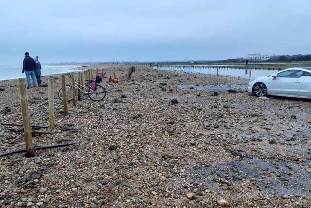 Debris left behind after adverse weather which has caused half of West Beach car park on Hayling Island to remain closed.
