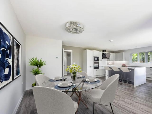 The listing says: "You are originally welcomed by a secure gated entrance leading to a spacious driveway for multiple cars. A stand alone garage with electric door is a further bonus for extra security or storage. The boundary to the property has a lovely wrap around patio space and the property itself offers plenty of space and light throughout."