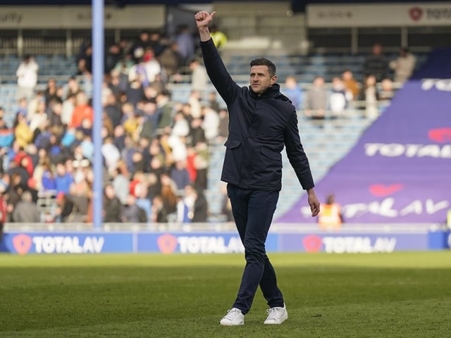 Pompey boss John Mousinho salutes the fans after the Blackburn win.
