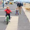 Children have been running, scooting and cycling up and down the zig zags for years.
Pictured is: (l-r) William Nicholas (4) with his brother Eddie (2) and dad Alex from Purbrook.