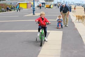 Children have been running, scooting and cycling up and down the zig zags for years.
Pictured is: (l-r) William Nicholas (4) with his brother Eddie (2) and dad Alex from Purbrook.