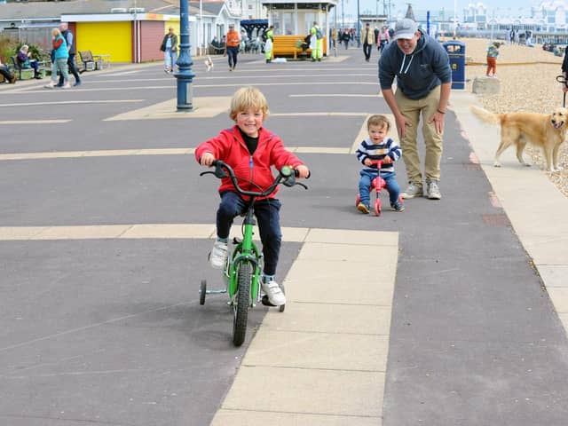 Children have been running, scooting and cycling up and down the zig zags for years.
Pictured is: (l-r) William Nicholas (4) with his brother Eddie (2) and dad Alex from Purbrook.