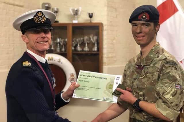 Royal Marine cadet Wyatt Dudley, 14, pictured as he was promoted to Lance Corporal. Pictured with Warrant Officer Mark Branson, commanding officer of the cadets.