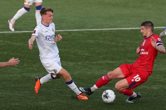 Harry Jewitt-White, pictured being fouled against Hampton & Richmond, is currently on loan with the Hawks. Picture: Dave Haines
