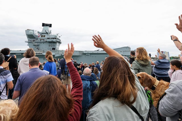 Well-wishers and loved ones of crew members welcomed home HMS Prince of Wales - with families gathering on the Round Tower to see them.