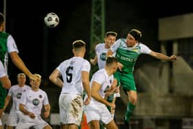 Tom Cain heads home Moneyfields' equaliser in last night's Portsmouth Senior Cup win over the Royal Navy Under-23s. Picture by Dave Bodymore.