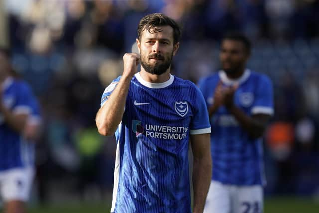 Joe Rafferty celebrates at the final whistle after Pompey saw off Lincoln 2-1 at Fratton Park