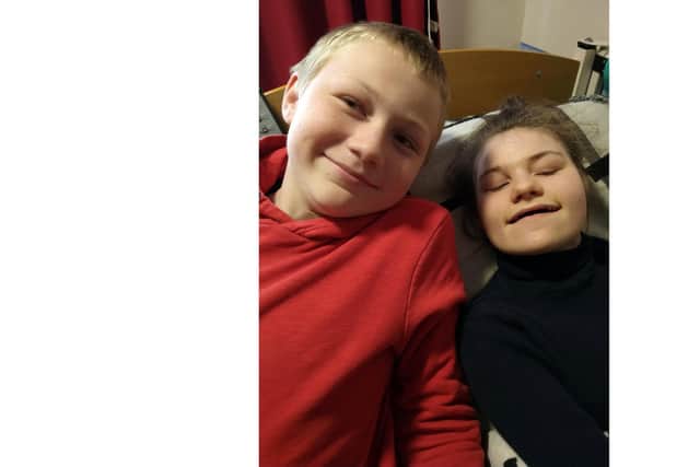 Eleanor Raleigh, 15, with her brother Lewis, 11, at home in Fareham