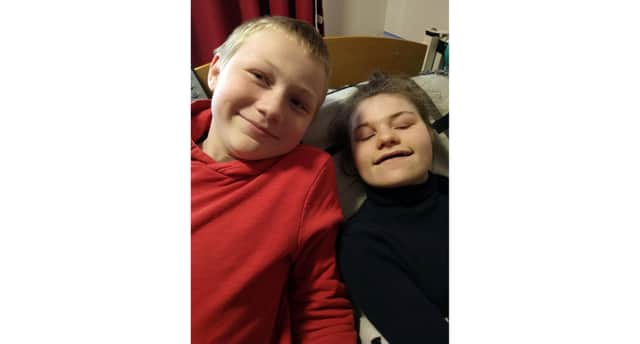 Eleanor Raleigh, 15, with her brother Lewis, 11, at home in Fareham