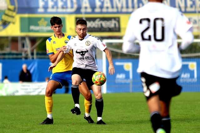 Finn Walsh-Smith, left, keeps a close eye on a North Leigh opponent. Picture by Tom Phillips