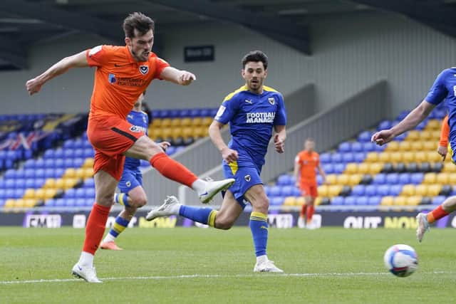 John Marquis shoots during Pompey's win at AFC Wimbledon. Picture: Jason Brown