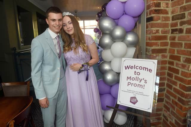 Molly Douch (16) from Milton, was told she could not attend her school prom at St Edmund's Catholic School down to her poor attendance as she has a chronic condition, Crohn’s disease. Molly's family and friends threw her a surprise prom at The Good Companion Pub in Portsmouth on Thursday, July 7.

Pictured is: Molly Douch (16) with her prom date Mitch Marie (17).

Picture: Sarah Standing (070722-1338)