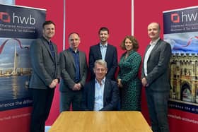 AUDIT STRENGTH. HWB’s registered auditors, standing from left: Directors James Flood and Gary Brown,