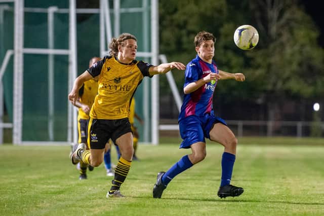 Ex-Pompey Academy player Oscar Johnson, left, in action for Baffins during Tuesday's win at US Portsmouth.
Picture: Habibur Rahman