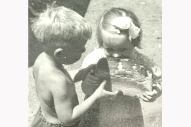 Gimme some! Paul Pannell with his niece Margaret in 1950. He is letting her nibble some home-made bread. Picture: Christine Pannell