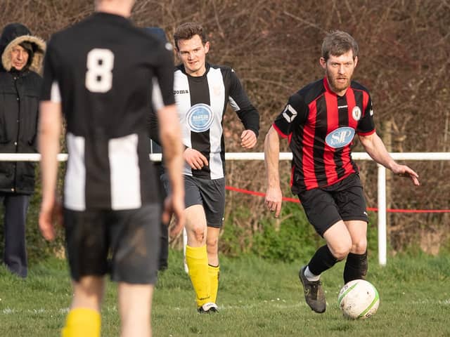 Laurence Wall (red/black) is one of just a few players who appeared for Locks Heath in the both the 2019/20 and 2020/21 seasons following the reappointment of Dave Fuge as manager. Picture: Keith Woodland
